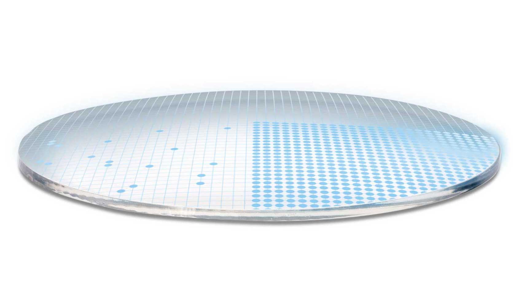 Ilustración tridimensional de un lente que muestra 700 puntos azules que representan los 700 parámetros libres para una superficie del lente de gran complejidad.