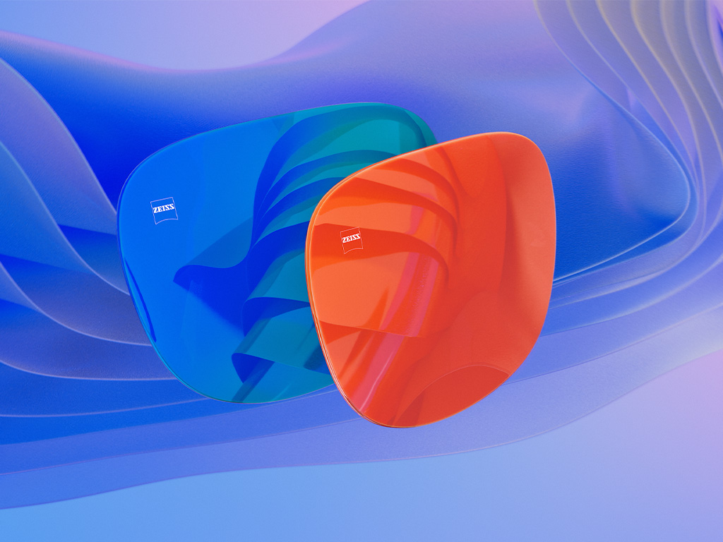 Ilustración CGI en 3D de dos lentes solares con un recubrimiento espejado azul y otro naranja.