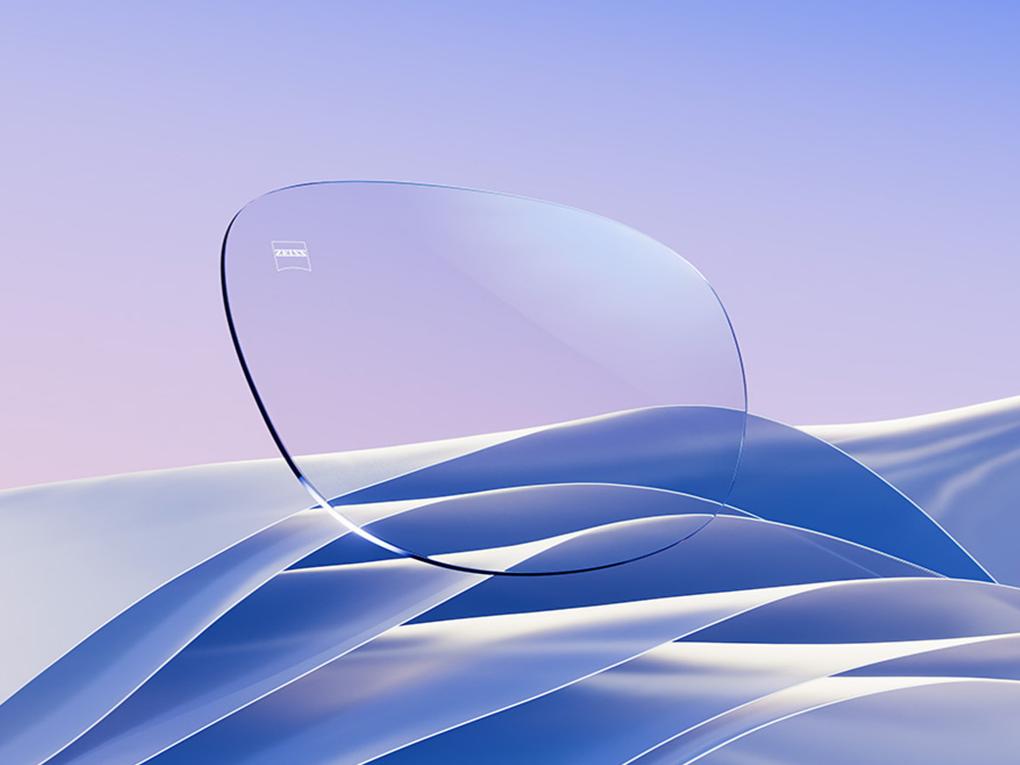 Representación por CGI de un lente transparente con un sutil reflejo blanco y azul.