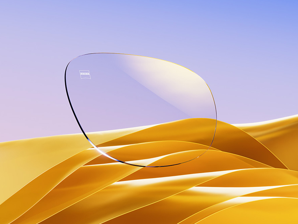 Representación por CGI de un lente transparente con un sutil reflejo dorado.