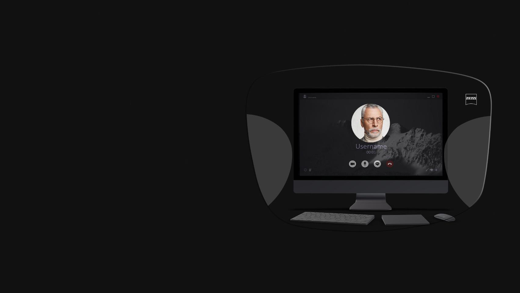La vista de un computador de mesa, un teclado, un ratón y un libro a través de una ilustración esquemática de unos lentes de oficina ZEISS Office muestra que todo está bien enfocado gracias a las zonas de visión cercana e intermedia optimizadas.