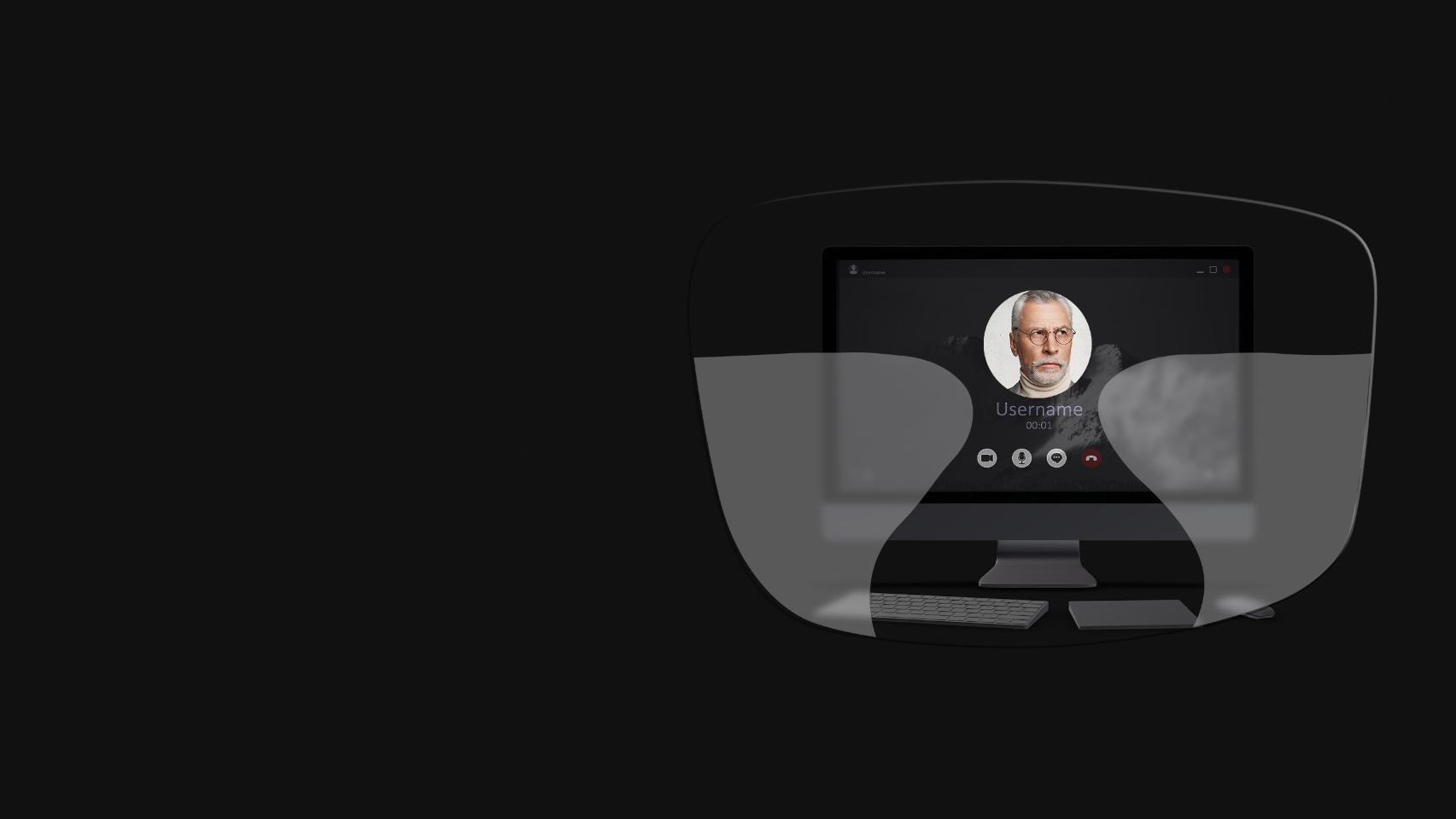 La vista de un computador de mesa, un teclado, un ratón y un libro a través de una ilustración esquemática de unos lentes progresivos muestra que las zonas de visión cercana e intermedia son demasiado pequeñas para ver con nitidez la pantalla.