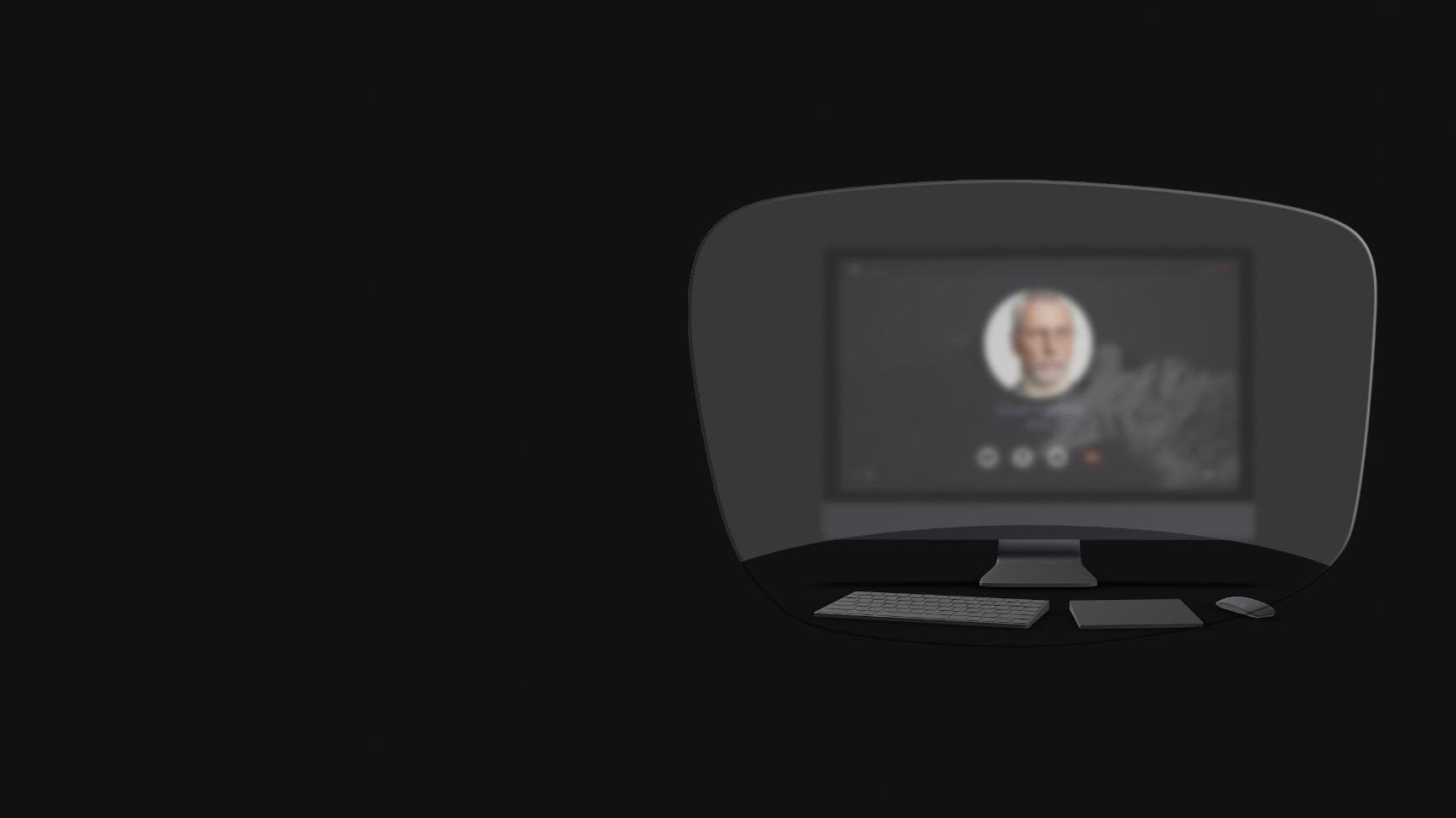 La vista de un computador de mesa, un teclado, un ratón y un libro a través de una ilustración esquemática de unos lentes para leer muestra que solo los objetos cercanos son nítidamente visibles. La pantalla del computador está borrosa.
