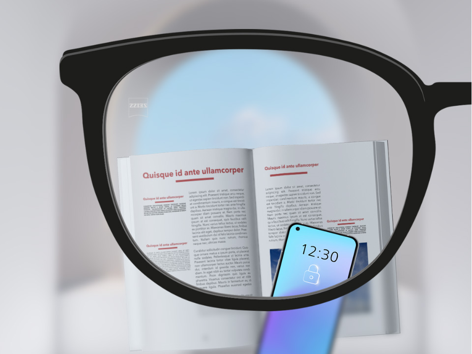 Una imagen desde un punto de vista con lentes de visión sencilla SmartLife de ZEISS con un smartphone y un libro, y el lente se ve completamente nítido.